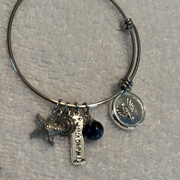 Silver toned bracelets with charms - Picture 2 of 3